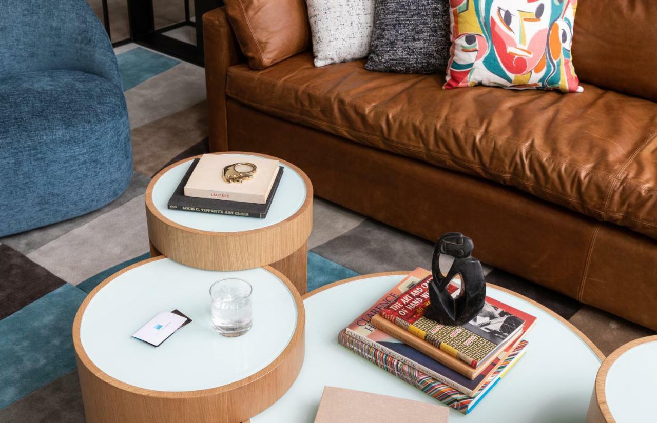 Hotel Murano Tacoma Exterior photo A coffee table with a stack of books